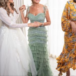 Green gown wedding guest or mother of the bride